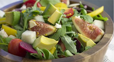 Salad with avocados, fruits, and vegetables