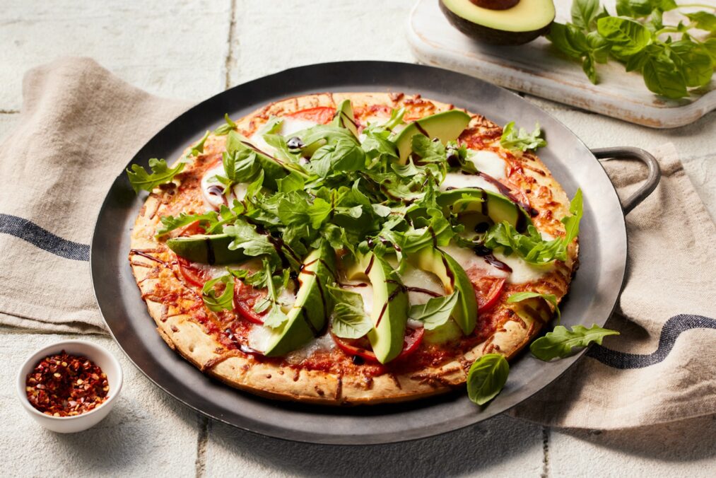 A photo of California Avocado Pizza Caprese