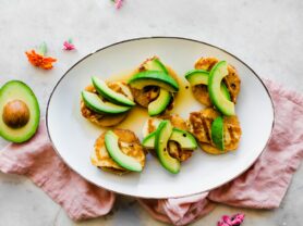 A photo of hot honey halloumi and California avocado mini polenta cakes