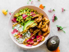 A photo of Japanese bbq shrimp rice bowl with California Avocado sriracha